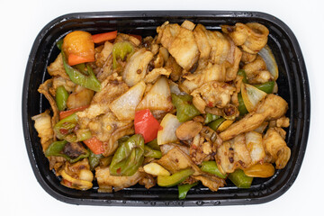 Chinese Sichuan Spicy Pork Belly with Bell Peppers Chili and Onions in a Black Plastic Container