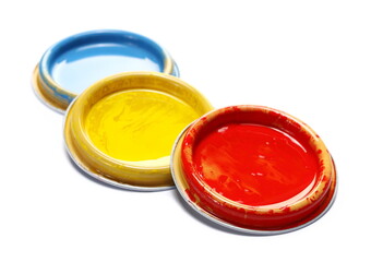 Colorful group can lid with spillage isolated on white 