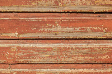 Horizontal wooden planks with terracota old peeling paint