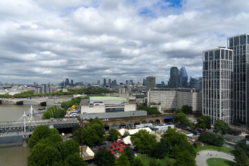 Obraz premium Aerial view of Hungerford Railway Bridge and Golden Jubilee Bridges at City of Westminster on a cloudy summer day. Photo taken August 3rd, 2022, London, United Kingdom.