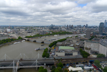 Aerial view of Hungerford Railway Bridge and Golden Jubilee Bridges at City of Westminster on a cloudy summer day. Photo taken August 3rd, 2022, London, United Kingdom.