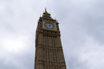 Cityscape with Elizabeth Tower with Big Ben bell at Westminster Palace at London on a cloudy summer...