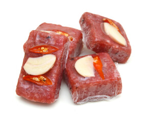 Sour pork : venamese northeastern style food which mixed pork rice garlic sugar and salt in banana leaf package.