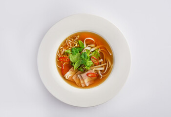 Pho Bo vietnamese soup with beef and rice noodles on a white background, top view. Asian fast food culture concept, Chinese or Thai cuisine
