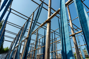 Naklejka premium Hanging of cloth strips in dyeing workshop in Wuzhen, China
