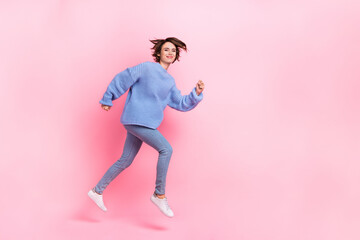 Full size profile side photo of running lady spend free time traveling isolated on pastel pink color background