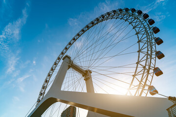 Closeup of a large ferris wheel on a playground