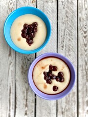 vanilla oat milk pudding with cherry confiture