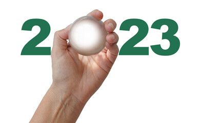 Fortune Teller's Crystal Ball predictions for 2023 - hand holding a crystal ball between 20 and 23...