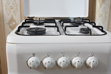 white gas stove in the kitchen closeup