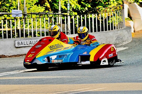 Blue, yellow and red side car  during the annual Tourist Trophy races on the Isle of Man, UK