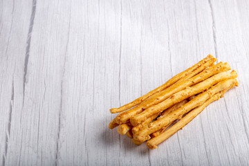 Portion of grissini on the table.