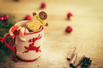 Christmas mug with Christmas decorations and cookies