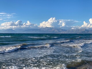 stormy sea in Acharavi, small resrt in Corfu island, Greece with Albania mountains in a distance