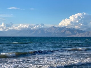 stormy sea in Acharavi, small resrt in Corfu island, Greece with Albania mountains in a distance