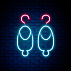 Glowing neon line Earrings icon isolated on brick wall background. Jewelry accessories. Colorful outline concept. Vector