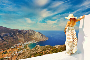 Young woman looking at Kamares beach of Sifnos island, Greece