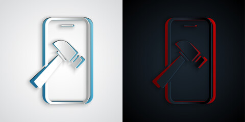 Paper cut Smartphone with broken screen icon isolated on grey and black background. Shattered phone screen icon. Paper art style. Vector