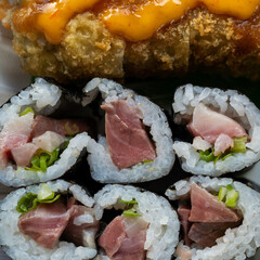 Japanese Sushi takeout food with fried vegetable rolls and sauce