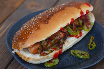 Hot dog with fried sausage and green pepper