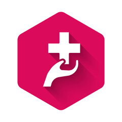 Obraz premium White Heart with a cross icon isolated with long shadow background. First aid. Healthcare, medical and pharmacy sign. Pink hexagon button. Vector