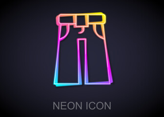 Glowing neon line Jeans wide icon isolated on black background. Vector