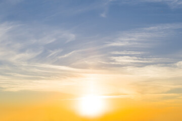 Naklejka na ściany i meble evening sun on cloudy sky, dramadic sunset background