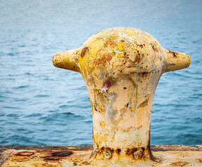 Artistic rust on mooring bollard on Puerto Rico pier - obrazy, fototapety, plakaty