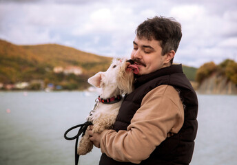 man and dog on a lake
