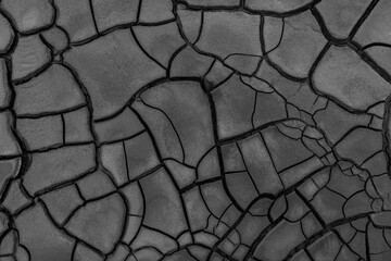 Cracked muddy surface dark grey