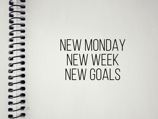 Inspirational and Motivational Concept - New monday new week new goals text background. Stock photo.