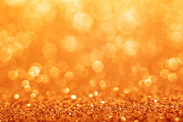 Gold defocused glitter background with copy space.