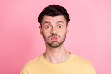 Portrait of impressed excited man stylish haircut yellow t-shirt holding breath staring speechless...