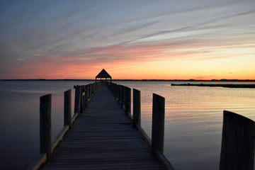 Fototapeta na wymiar evening sunset image on the bay from a pier in Ocean City MD.
