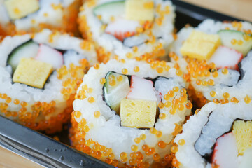 detail shot of Sushi roll with salmon, shrimps and avocado 