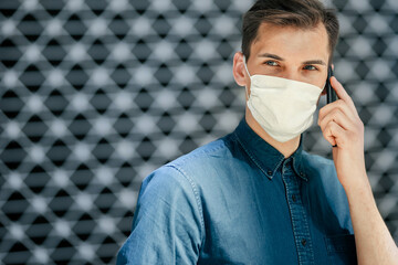 close up. a young man in a protective mask looking at you