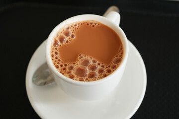 close up of cup of milk tea on table 