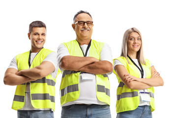 People wearing reflective safety vests and posing with crossed arms