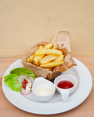 French fries with ketchup and mayonnaise