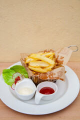 French fries with ketchup and mayonnaise