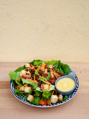 Fresh caesar salad with crispy bacon and crouton