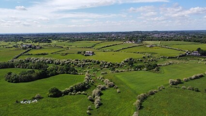 Obraz premium Aerial view of green fields and open countryside. Taken in Lancashire England. 