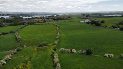 Obraz premium Aerial view of green fields and open countryside. Taken in Lancashire England. 