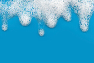 Soap foam. Background of dusty foam with bubbles of blue color for an inscription. Soap sud with copy-space - obrazy, fototapety, plakaty