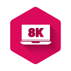 White Laptop screen with 8k video technology icon isolated with long shadow. Pink hexagon button. Vector