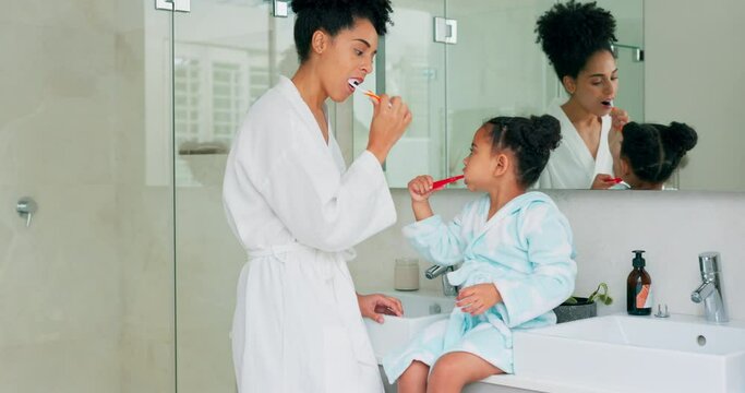 Dental, bathroom and mother and child brushing teeth for oral health, teeth healthcare and cleaning mouth with toothbrush. Black family morning routine, toothpaste and mom teaching self care hygiene