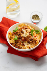 Close up of italian pasta bolognese in white bowl