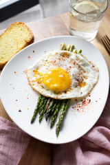Grilled eggs with green asparagus. Healthy vegetarian food.