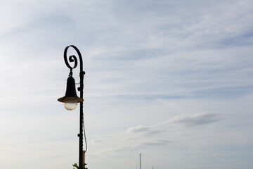 Wrought iron street lamp very typical in the towns and cities of Catalonia. - obrazy, fototapety, plakaty