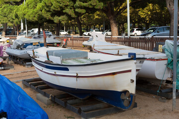 Marina with small boats moored at the quay in Sant Feliu de Gixols, Catalonia, Spain